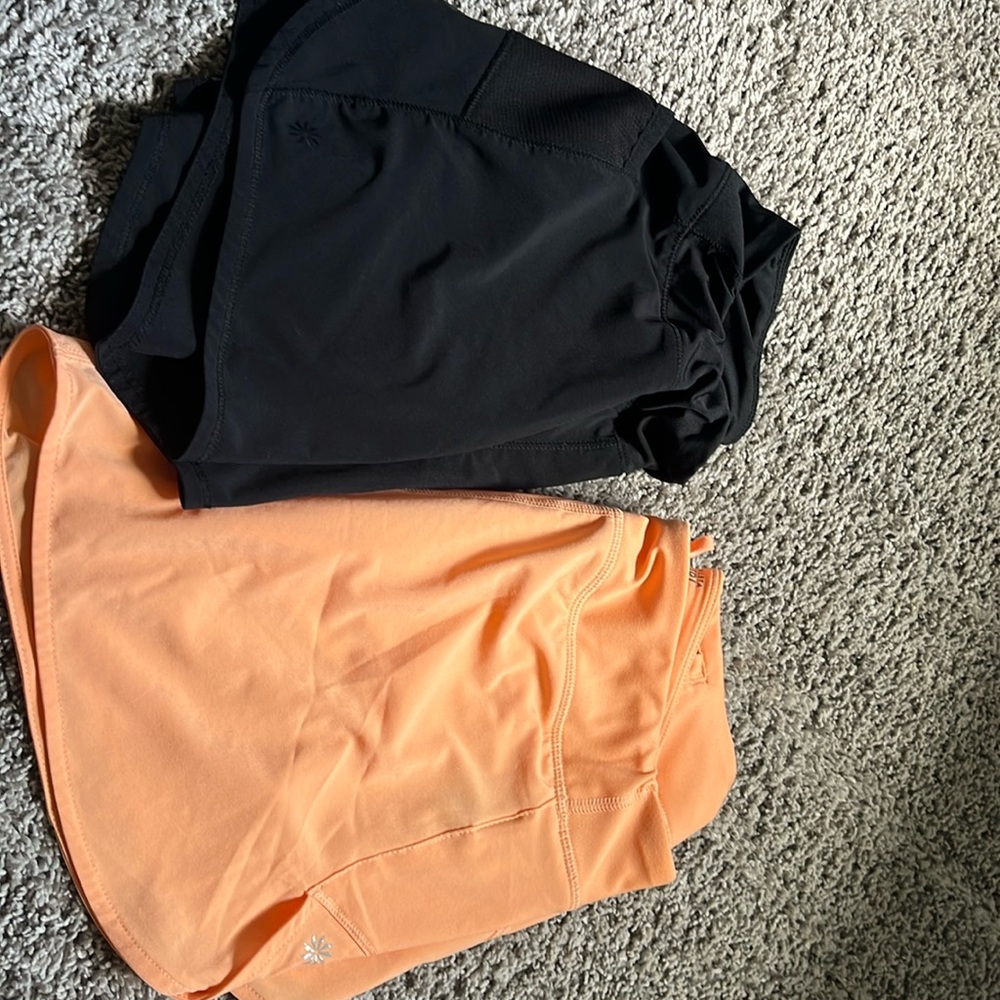 Athleta girl shorts in sizes XL/14 black&orange